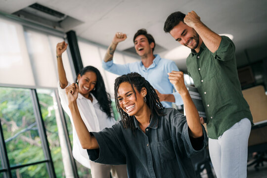 Success group of multiethnic entrepreneurs and business people achieving goals in corporate office