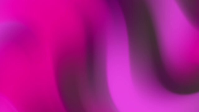 Vibrant fuchsia and purple abstract background with smooth, flowing gradient waves, creating a modern and dynamic texture for digital designs and creative projects.