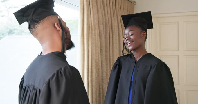 Graduating students in caps and gowns celebrating achievement at home