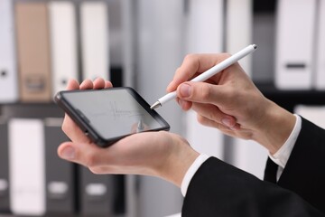 Electronic signature. Man using stylus and smartphone indoors, closeup