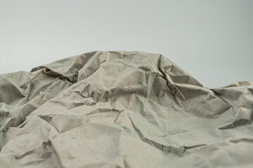 An abstract mountain landscape made from crumpled paper, showcasing the artists creative expression and sustainability