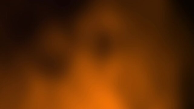 A blurred gradient of warm orange and brown tones that gives an impression of fire or heat.