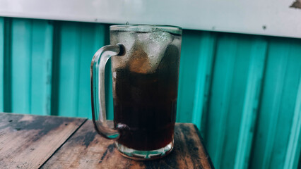 fresh iced tea with green metal wall