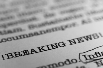 Breaking News headline. Text printed on a page. A piece of paper with a phrase written in retro typewriter font
