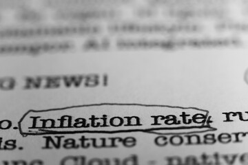 Inflation rate. Text printed on a page. A piece of paper with a phrase written in retro typewriter...