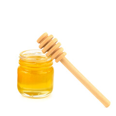 Bee honey in a jar isolated on white background.
