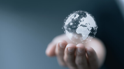 Holding the World: A hand gently cradles a transparent glass globe, symbolizing interconnectedness, responsibility, and the delicate nature of our planet.