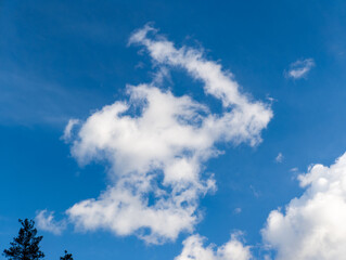 A blue sky with some white clouds in it