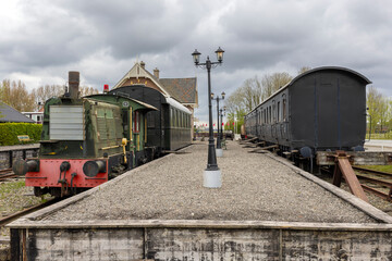 Vintage train resting on tracks in a cloudy day in Marrum, Friesland, Netherlands