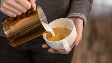Barista coffee service concept.Barista women using coffee machine to make coffee in cafe