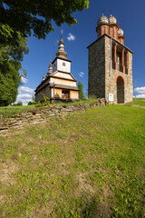 Naklejka premium Greek catholic church of the Protection of the Mother of God in Owczary, Poland, facing blue sky