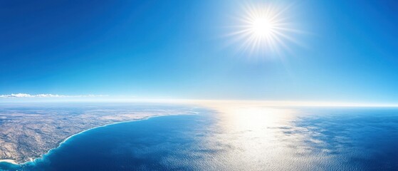 Obraz premium Aerial View of Coastline Meeting Ocean Under Bright Sun in Summer Clear Blue Sky Landscape Photography