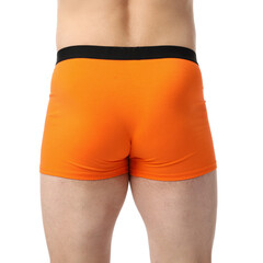Young man in stylish orange underwear on white background, closeup