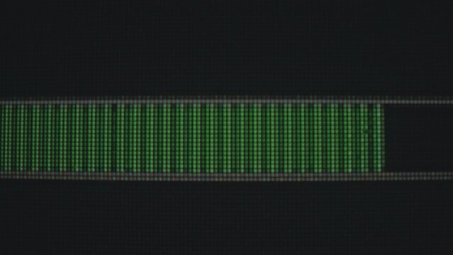 Green Digital Progress Bar on Dark Background Screen Display
