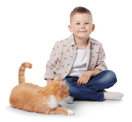 Obraz premium Little boy with her cute ginger cat on white background