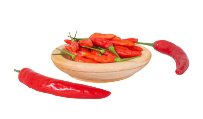 a pile of red hol chili on a wooden plate