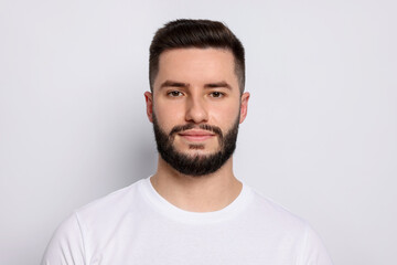 Portrait of handsome man on light background