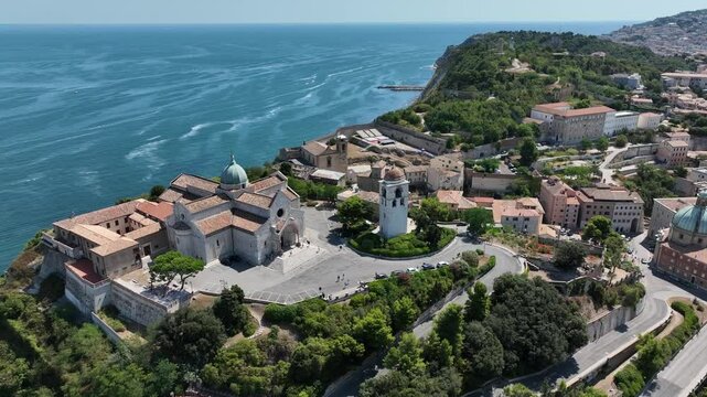 Aerial 4K footage of Ancona Cathedral on a hilltop overlooking the Adriatic Sea. Historic architecture, coastal view, and scenic landscape in central Italy.