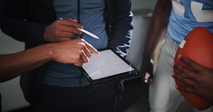 Tablet screen, coaching and football with hands in locker room for game plan, sports strategy or defense formation. Touchdown tactics, match feedback and discussion with people and training advice