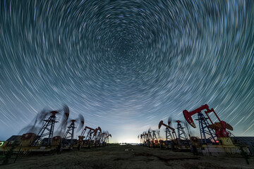 The oil pump under the starry sky in Daqing Oilfield, Daqing City, Heilongjiang Province, China