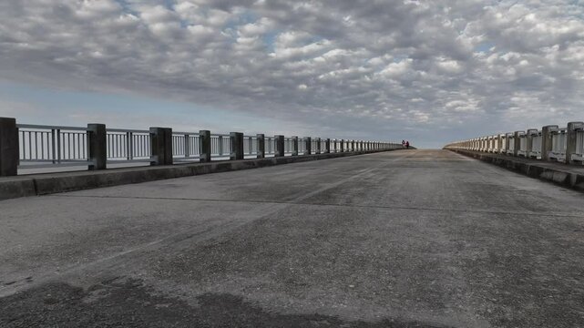 Old highway road bridge converted to public walking path over Lake Marion, South Carolina beside Interstate Highway  95