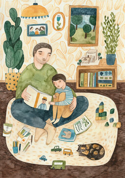 Father and son in a living room, reading a book together.