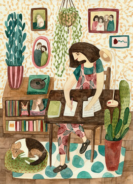 A girl in her office or living room, behind a desk and writing on a paper