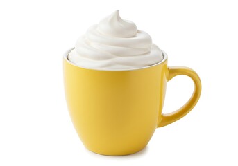 Yellow mug filled with whipped cream on white surface