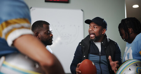 Mentor, man and football with coach and team in locker room for game plan, sports strategy or...