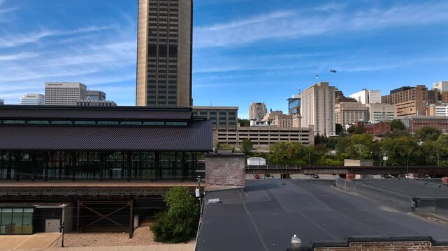 Richmond, VA city skyline office buildings and streets downtown in afternoon sunshine against blue sky and clouds beautiful southern architecture