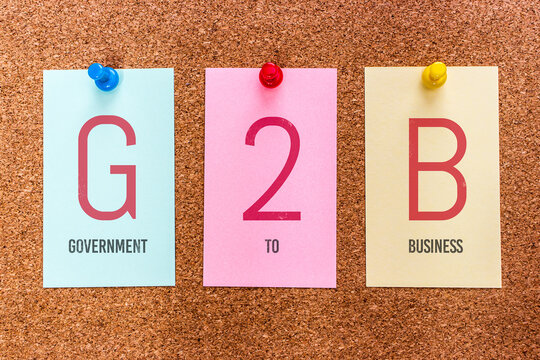 Conceptual 3 letters keyword G2B (Government to Business), on multicolored stickers attached to a cork board.