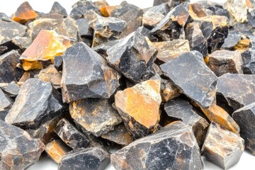 Pile of dark, irregular, broken rocks.  Pieces vary in size and exhibit dark gray to black colors with hints of orange