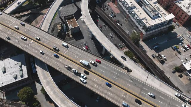 Traffic with cars and trucks on Interstate 95 driving through downtown Richmond, VA showing highway interchanges and city streets
