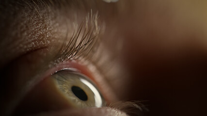 Human eye with blue iris, close up macro shot. Waking time and life-changing moment concepts.