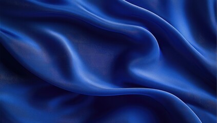 Obraz premium Deep blue silky fabric drapes in flowing folds. Close-up view of luxurious smooth texture