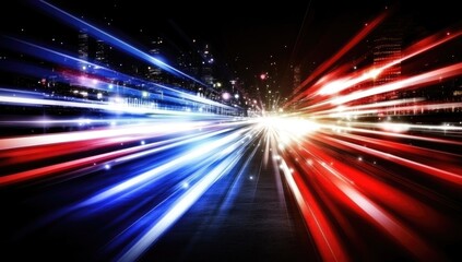 City lights streak across a night road in a vibrant display of motion.  A dynamic blend of blue and red light trails creates a sense of speed and energy