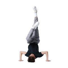 Boy in stylish clothes dancing on white background