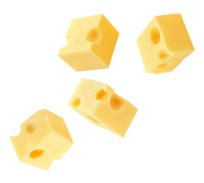 Flying Cheese pieces isolated on white. Levitating maasdam cheese cubes. Holey Chese Explosion. Top view. Flat lay.  Package design element.  Creative layout.