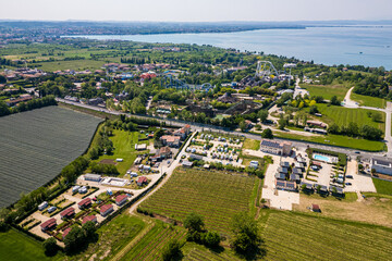 Aerial drone view of an amusement park Gardaland at Lake Garda, Italy. Amazing view of theme park Gardaland in Italy, with  campsites for motorhomes or campervans.