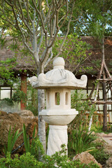 Japanese Style Stone Lantern Called Toro in the Garden