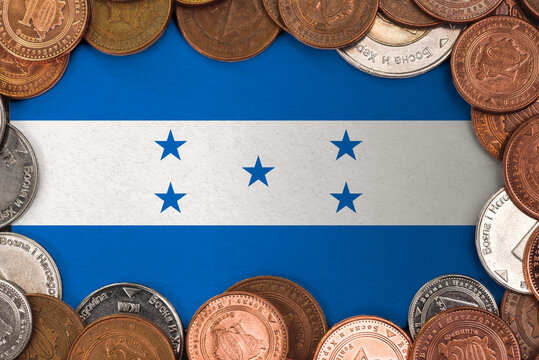 Coins on flag of Honduras trading investment business currency concept
