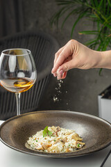 risotto with brown champignon mushrooms and white wine. dish of Italian cuisine