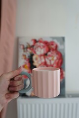 woman holding cup of tea