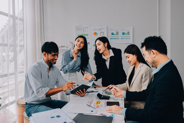 Team of financial advisory services. Asian advisor showing plan of investment to clients in the consultancy office..