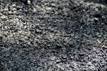 Dark black asphalt texture. Grunge, stone, building material background.