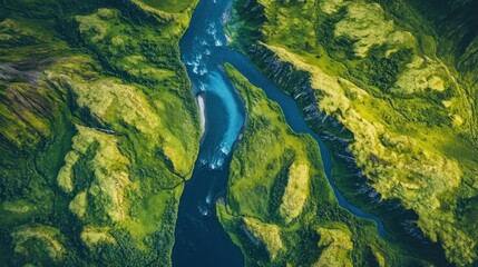 High-angle view of a winding river through lush green terrain.