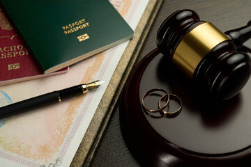 Divorce Decree with Wedding Rings, Passports, and Gavel