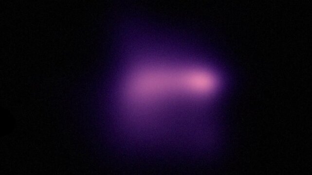 Black background with abstract purple neon light speckled grains, bright color gradient with soft texture