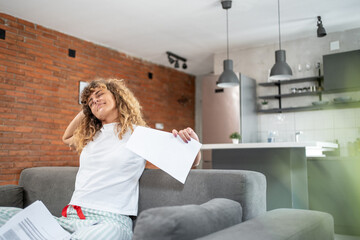 Woman relaxing on sofa after finishing work from home
