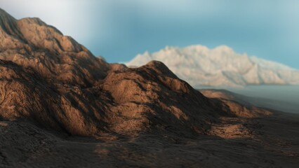 Rocky landscape with snow-capped mountains illuminating under blue sky